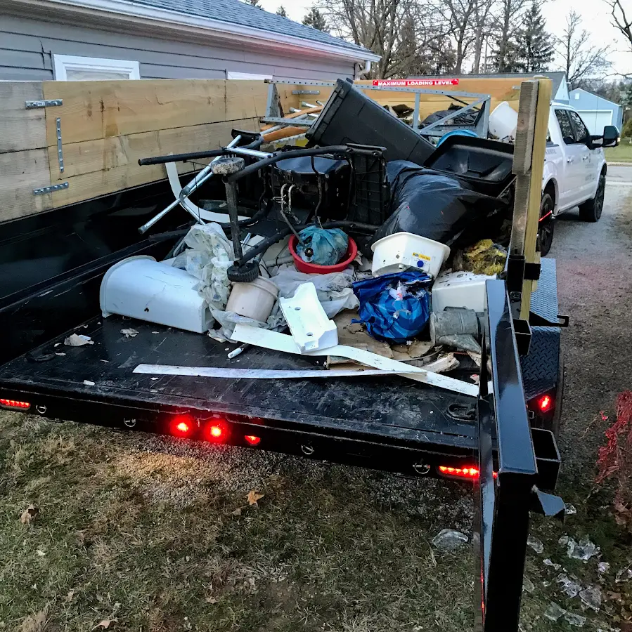 Roll-off dumpster delivered to a residential driveway in Oconto Falls